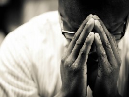 Picture of a penitent person at The Sacrament of Reconciliation